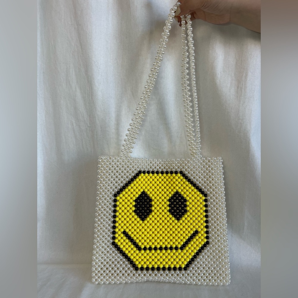 Fashion brand pearls bag women.